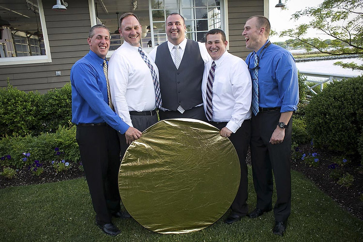 photo13.jpeg group of men holding a reflector